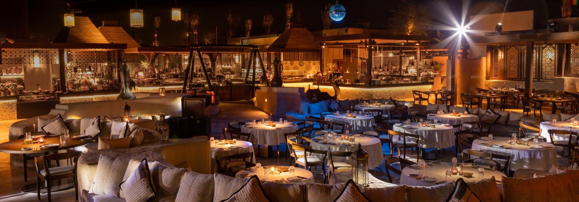 Panoramic view of the open-air dining area at Al Hadheerah, Bab Al Shams