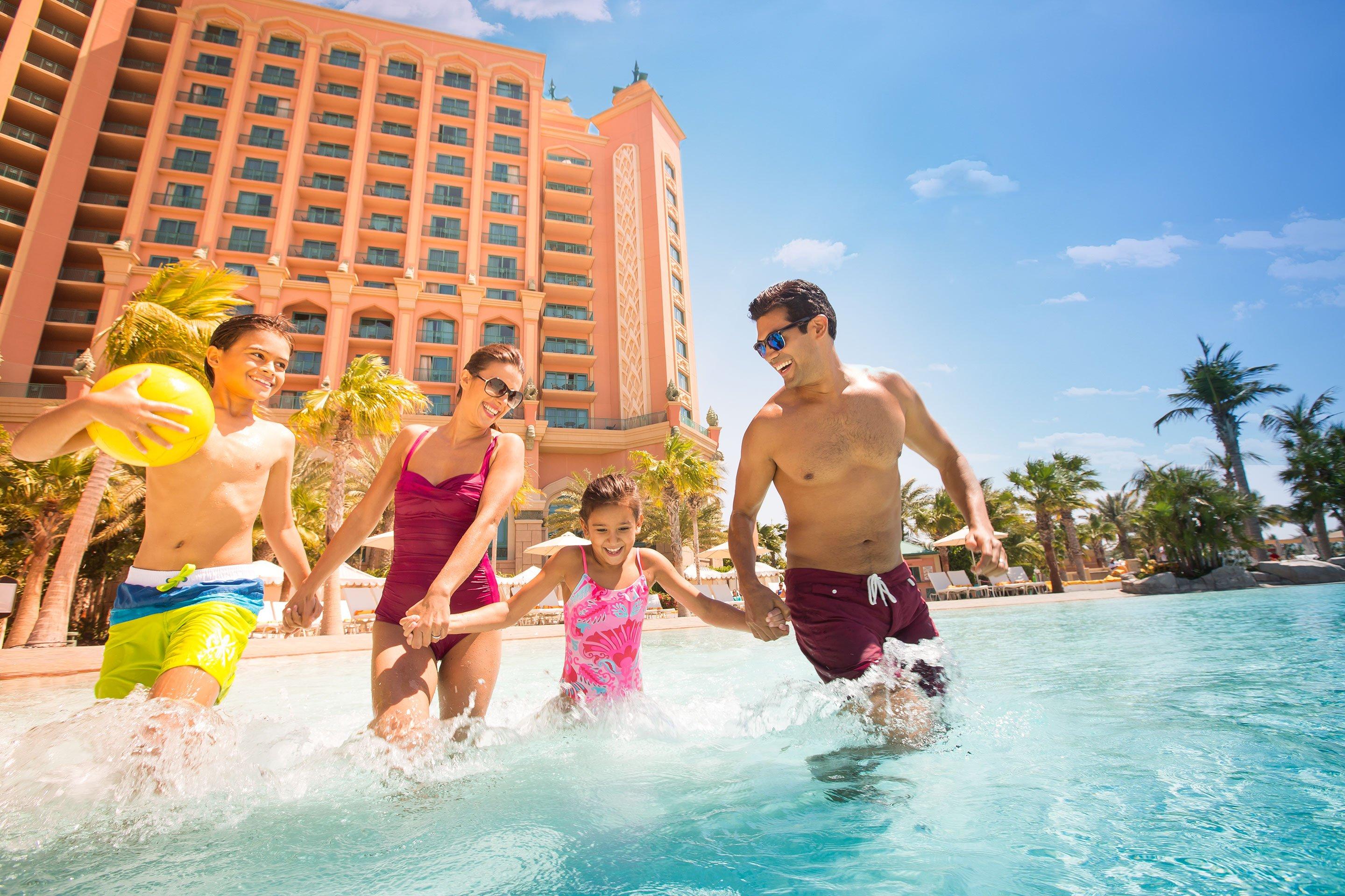 Family at the pool in Atlantis, The Palm