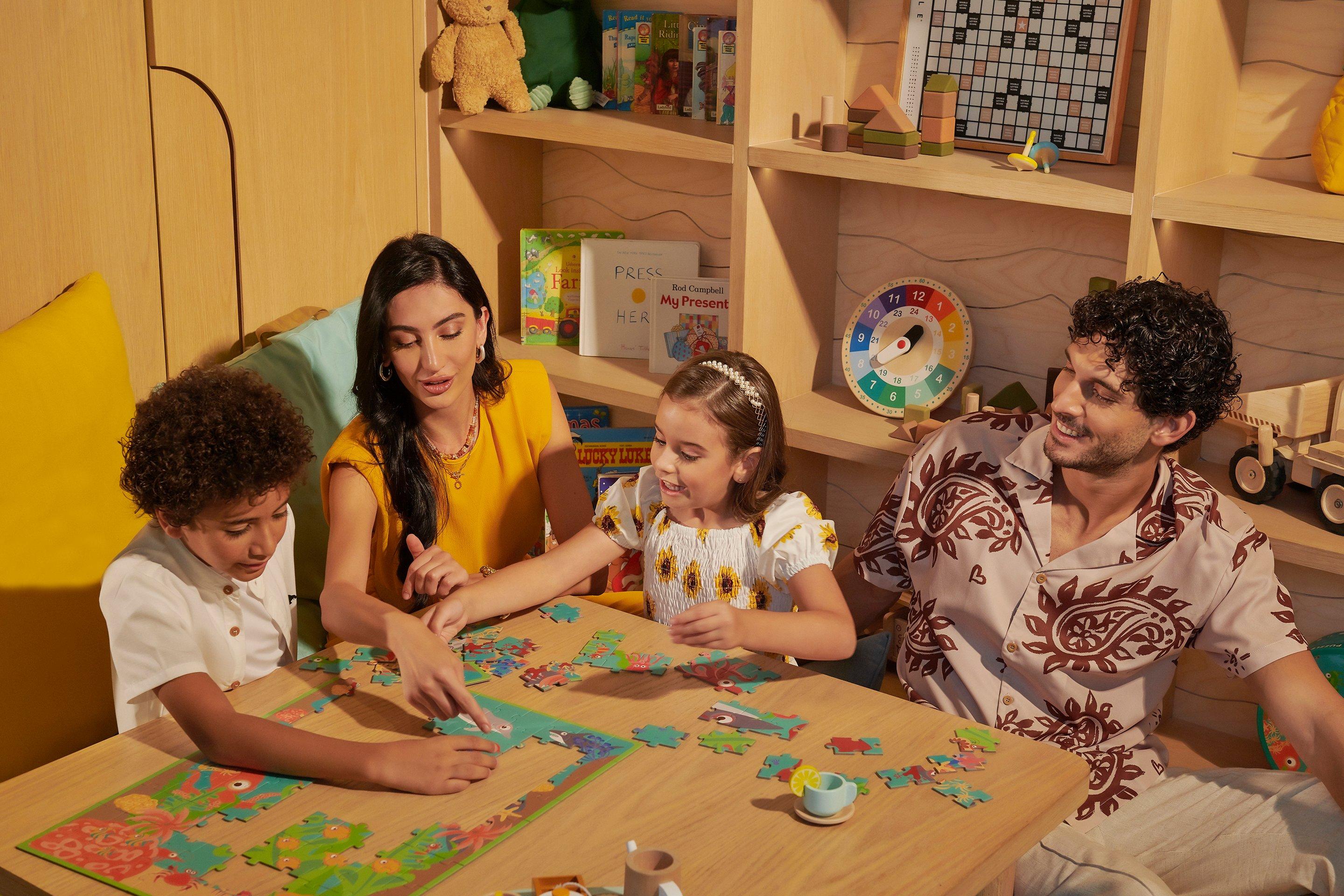A family playing games at Bab Al Shams Kids Club
